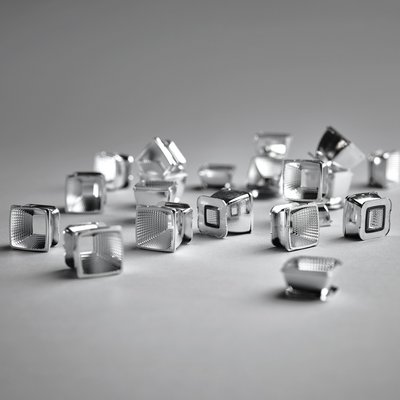 Drop plastic free-form faceted reflectors in silver Drop lighting technology from Artluce: Plastic free-form faceted reflectors in silver
